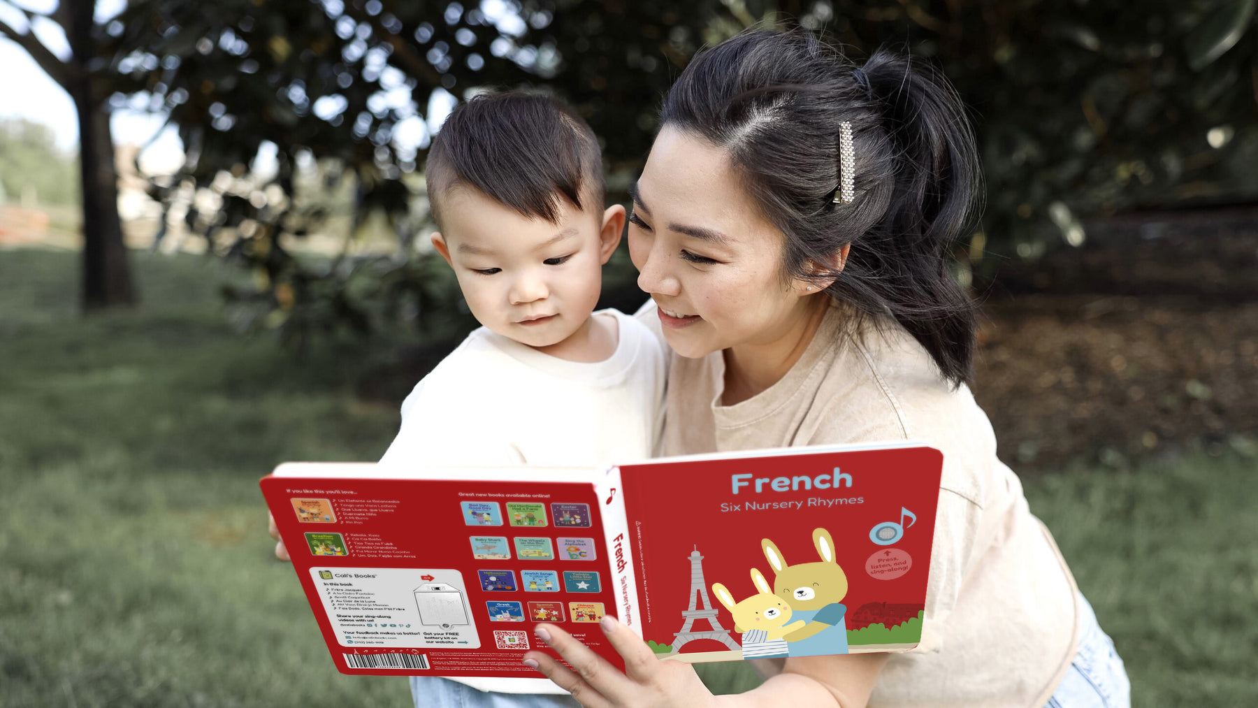 A Mom is reading a French book to her young son. Fun educational kids activities, languages