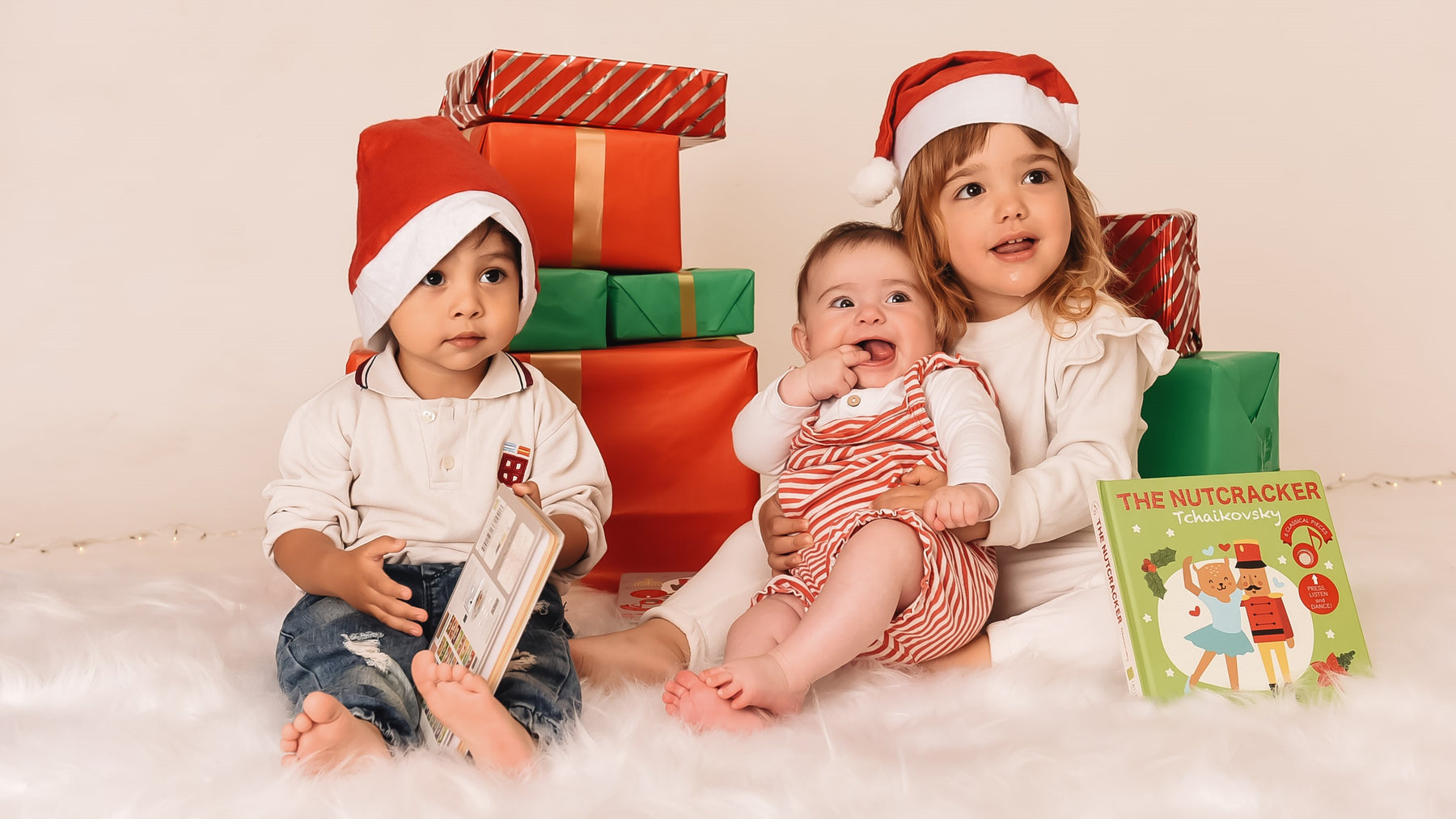 Three kids are posing with Christmas gifts. Fun, educational Christmas gift for kids.