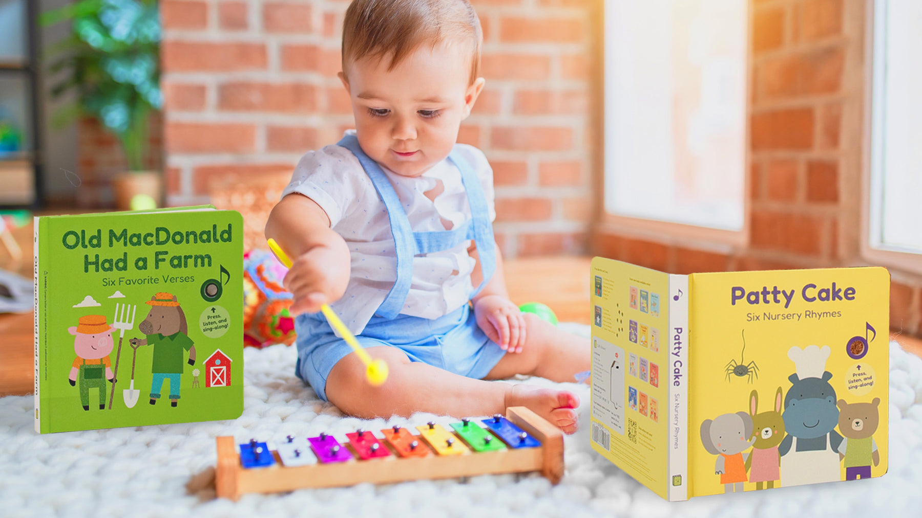 A baby is playing on a keyboard and sitting down on a carpet with musical books. Babies songs, children musical books, educational, music activities.