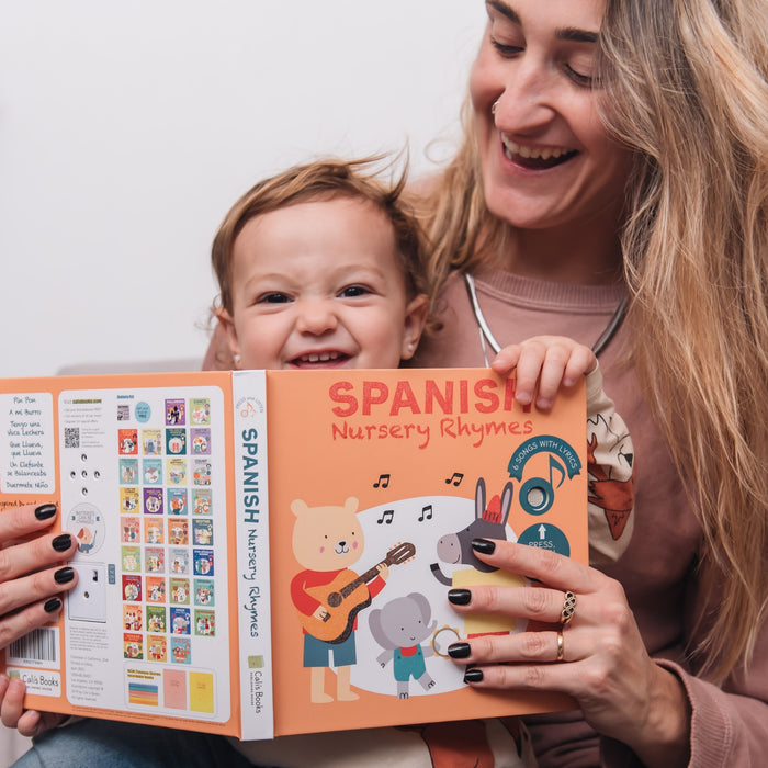 A Mom is reading a book with her two kids. Fun children activity, bilingual books. 