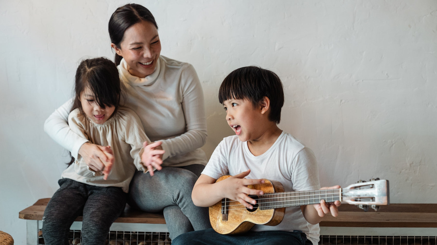 A Mom, a girl and a boy are singing together. Fun, music, songs, kids activities, nursery rhymes.