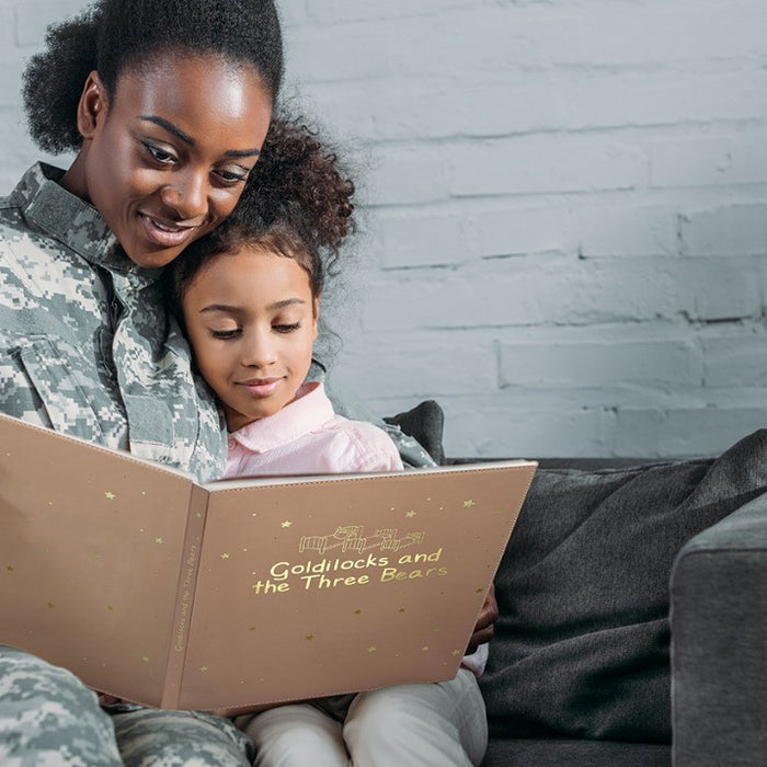 A military Mom is reading a book to her daughter. Long distance parenting, kids education.