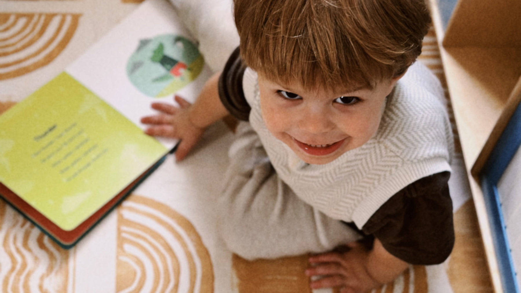 Close up of a boy looking up and smiling. Kids, educational strategies, fun activities.