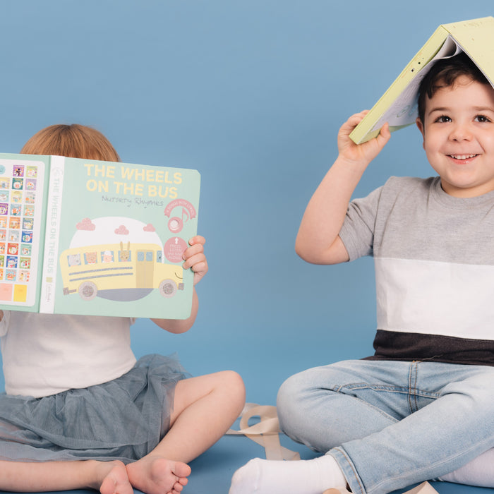 Two kids are reading and playing with books. Fun educational activity, ADHD strategies. 