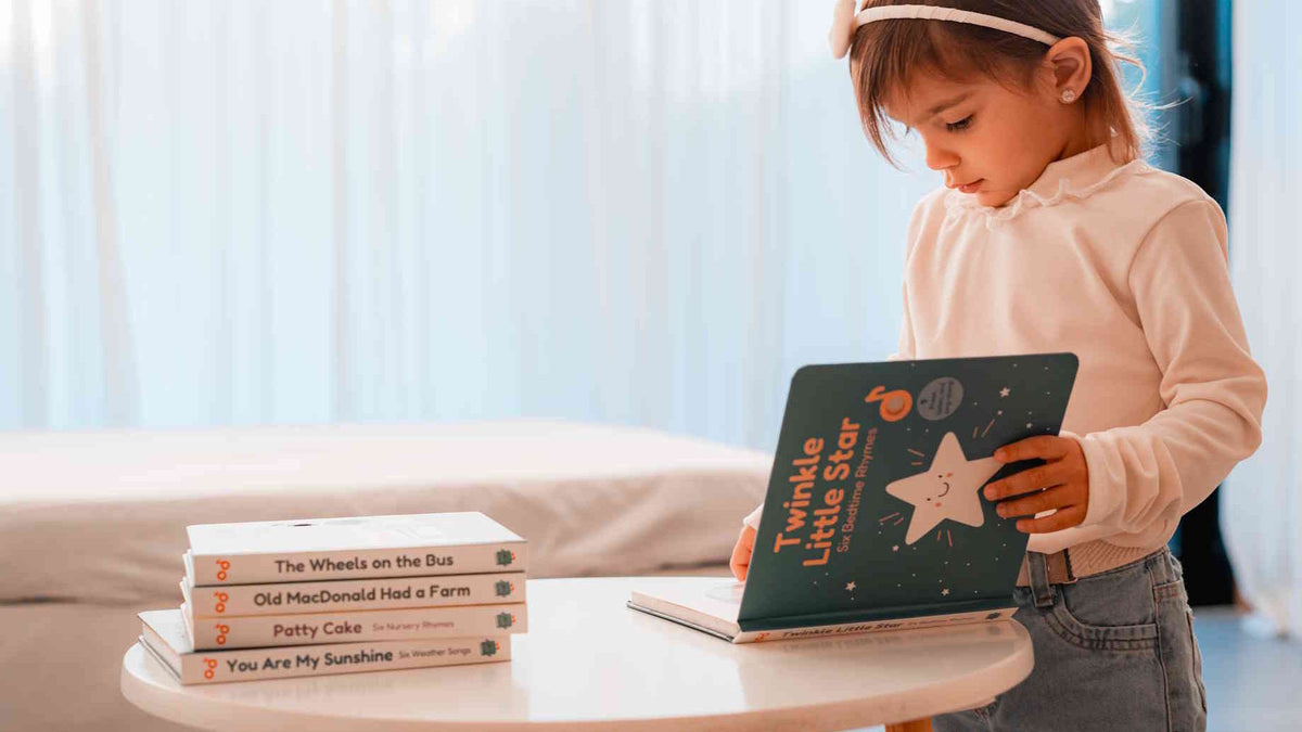 Child opening a sound book